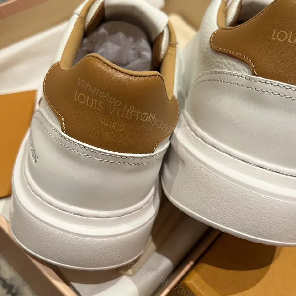 View 7 of White Leather Low-Top Sneakers - Contrasting Tan Accents & LV-Inspired Details