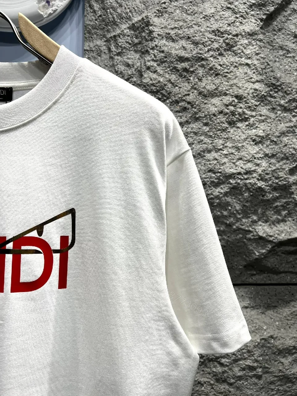 View 9 of White Cotton Tee: Bold Fendi Logo, Minimalist Luxe Crewneck