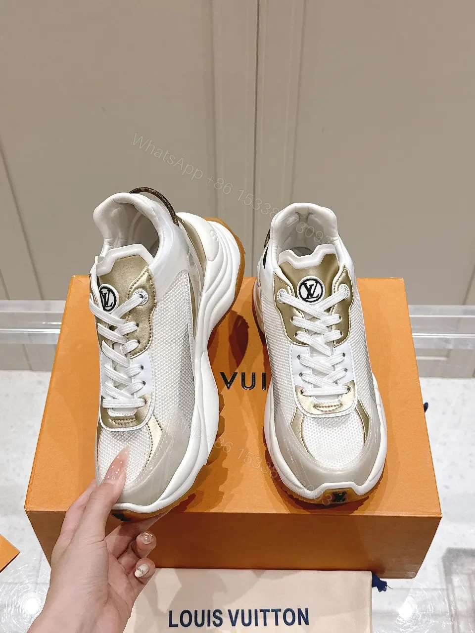 View 8 of Chunky White & Gold Luxe High-Tops: Signature LV Motif Sneakers