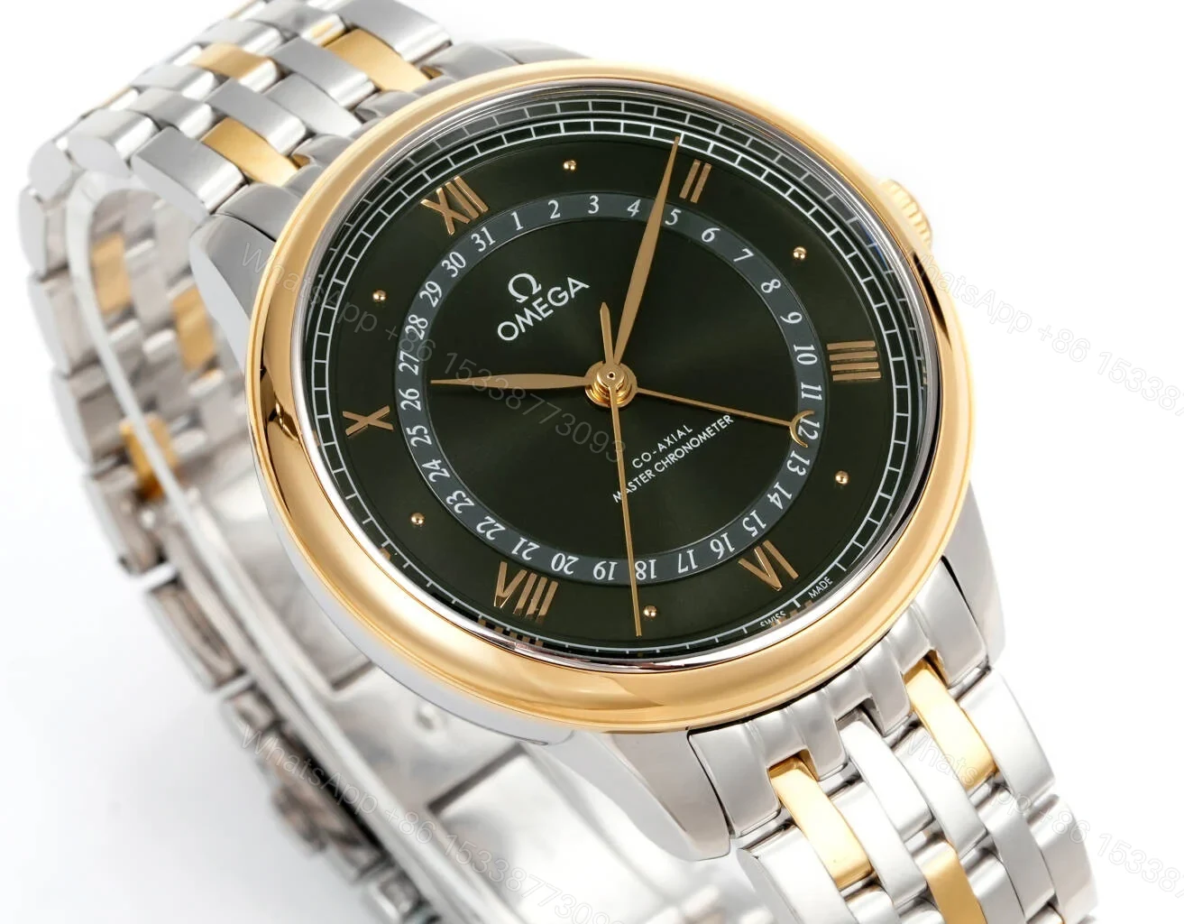 View 2 of Omega De Ville Prestige Co-Axial Master Chronometer Pointer Date 42 Stainless Steel Yellow Gold Green Sunburst Bracelet 434.20.42.22.10.001