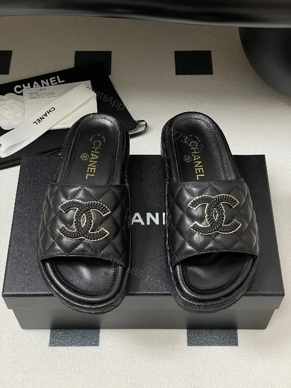 View 9 of Quilted Black Slip-Ons with Gold Emblem – Luxe Style