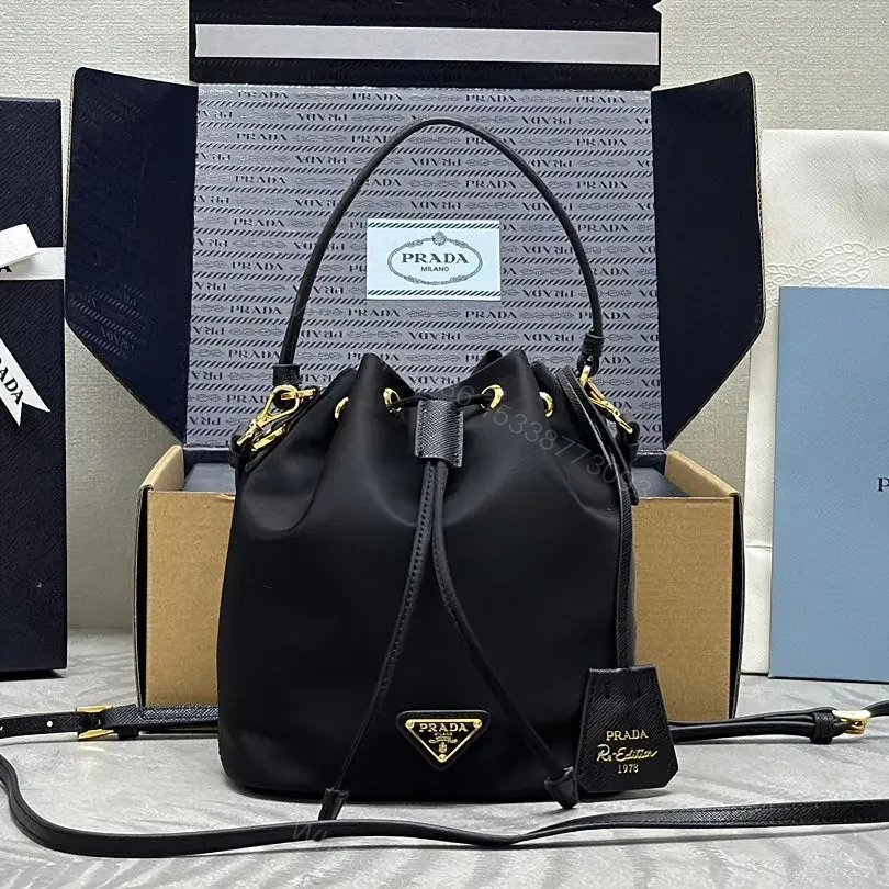 BUCKET BAG 19 IN BLACK RE-NYLON AND CALFSKIN HANDLE — view 1