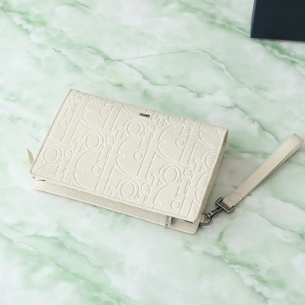 View 5 of Refined Monogram Clutch: Textured Grain, Silver Hardware, Lightweight Crossbody