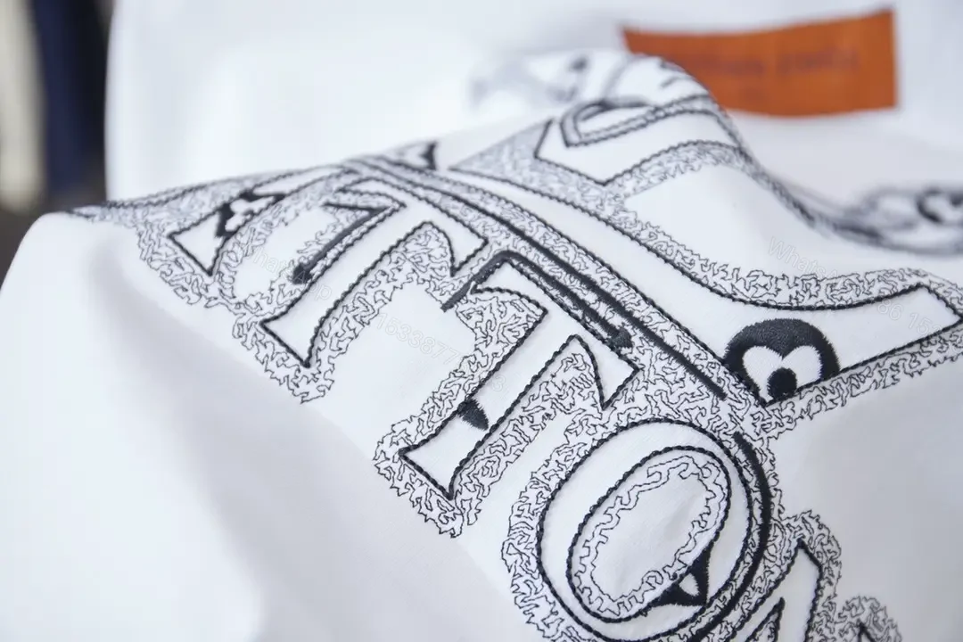 View 9 of Minimalist Luxe Tee with Subtle Crest – White Cotton Tee