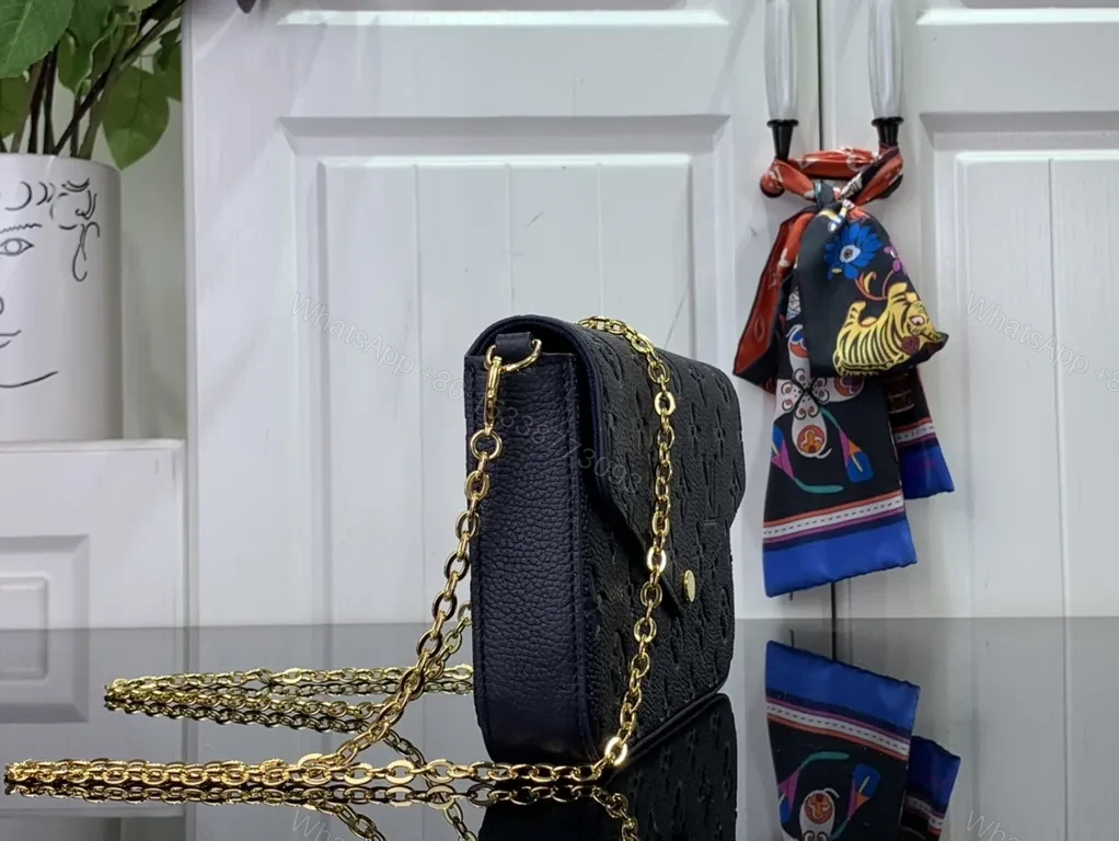 View 6 of Chic Leather Crossbody: Monogram Texture, Gold Hardware, Compact Envelope