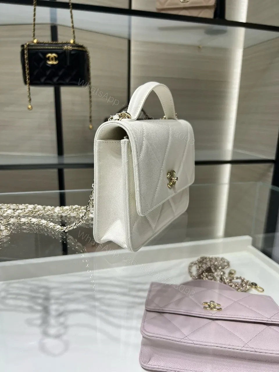 View 5 of White Quilted Mini Bag: Gold Logo, Structured Luxury, Compact