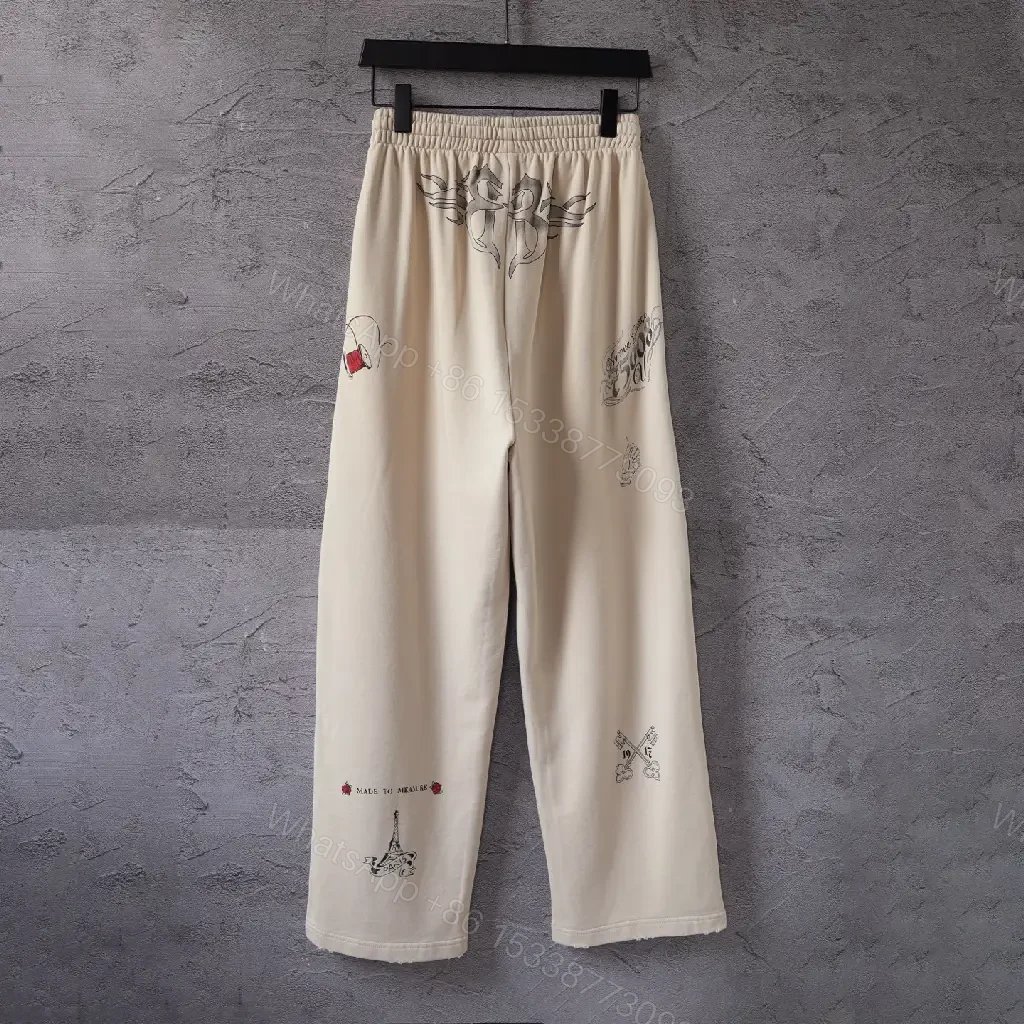 View 10 of Beige Wide-Leg Pants with Drawstring and Embroidered Patches