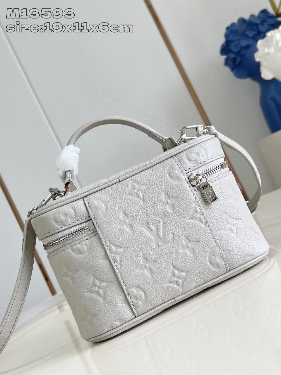 View 2 of Soft White Leather Compact Day-to-Night Bag with Textured Pattern