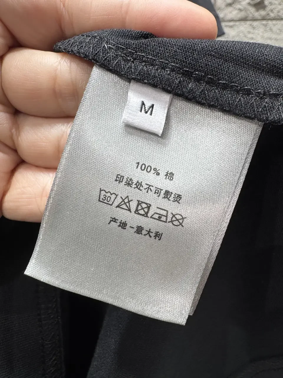 View 4 of Minimalist Black Tee with Subtle Logo – Everyday Luxe Tee