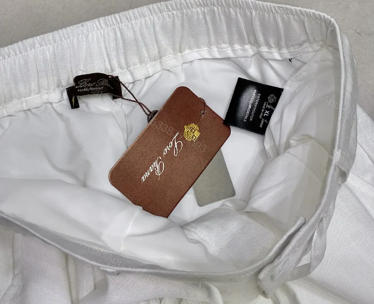 View 9 of Off-White Cream Wide-Leg Trousers with High Waist and Front Fly Closure