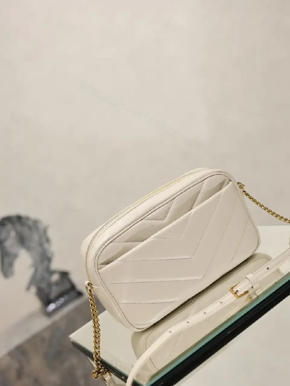 View 9 of Off-White Cream Quilted Chevron Crossbody Bag with Gold Logo