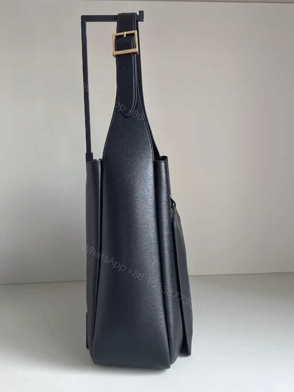 View 3 of Navy Leather Bucket Bag with Gold YSL Charm and Zippered Pocket