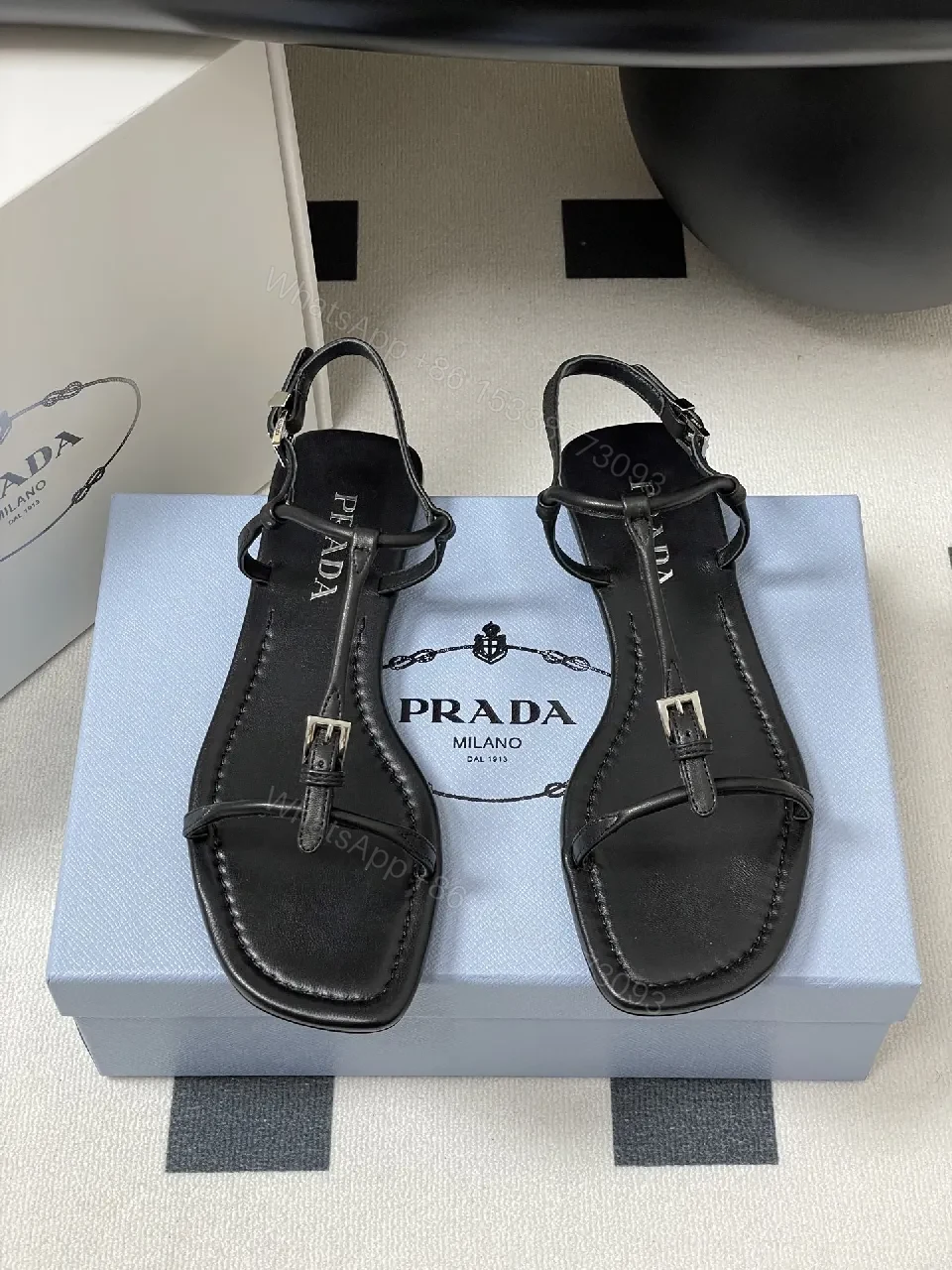 View 2 of Minimal Black Leather T-Strap Sandals with Padded Comfort