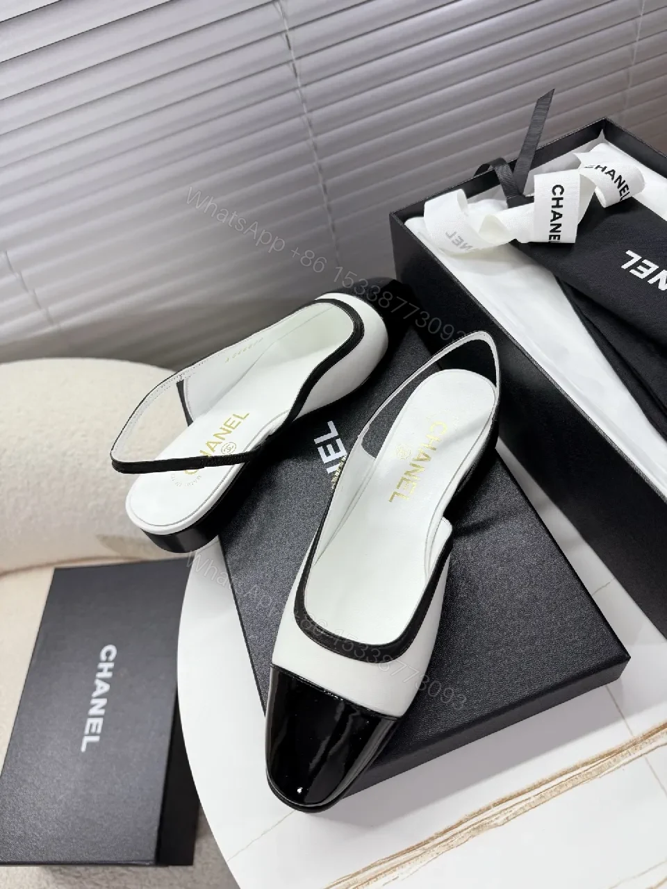 View 8 of Two-Tone Patent Slingback Pumps: Sharp Architectural Elegance