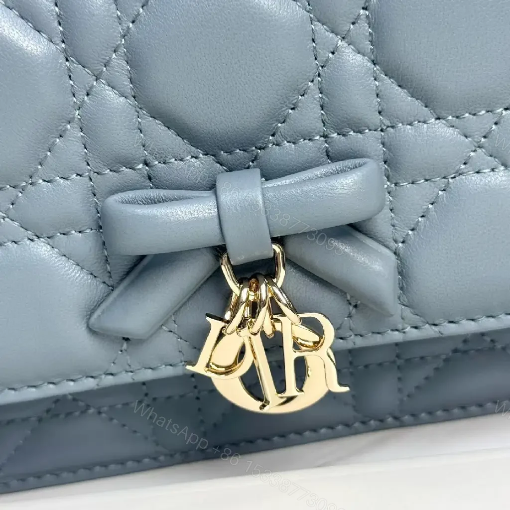 View 5 of Muted Blue-Gray Quilted Crossbody with Bow Charm, Luxe Everyday