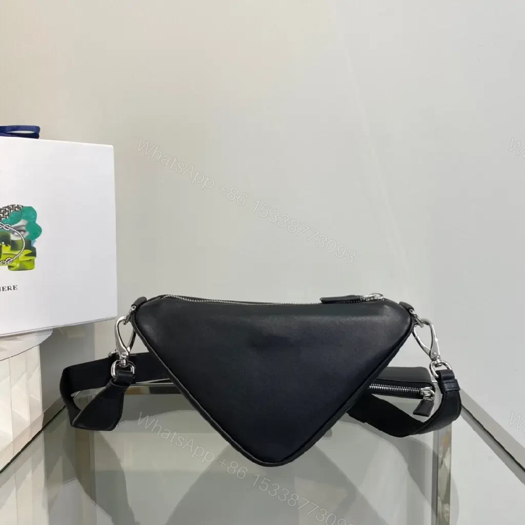 View 6 of Triangular Black Leather Belt Bag — Modern Minimalist Luxury Perforated Edge
