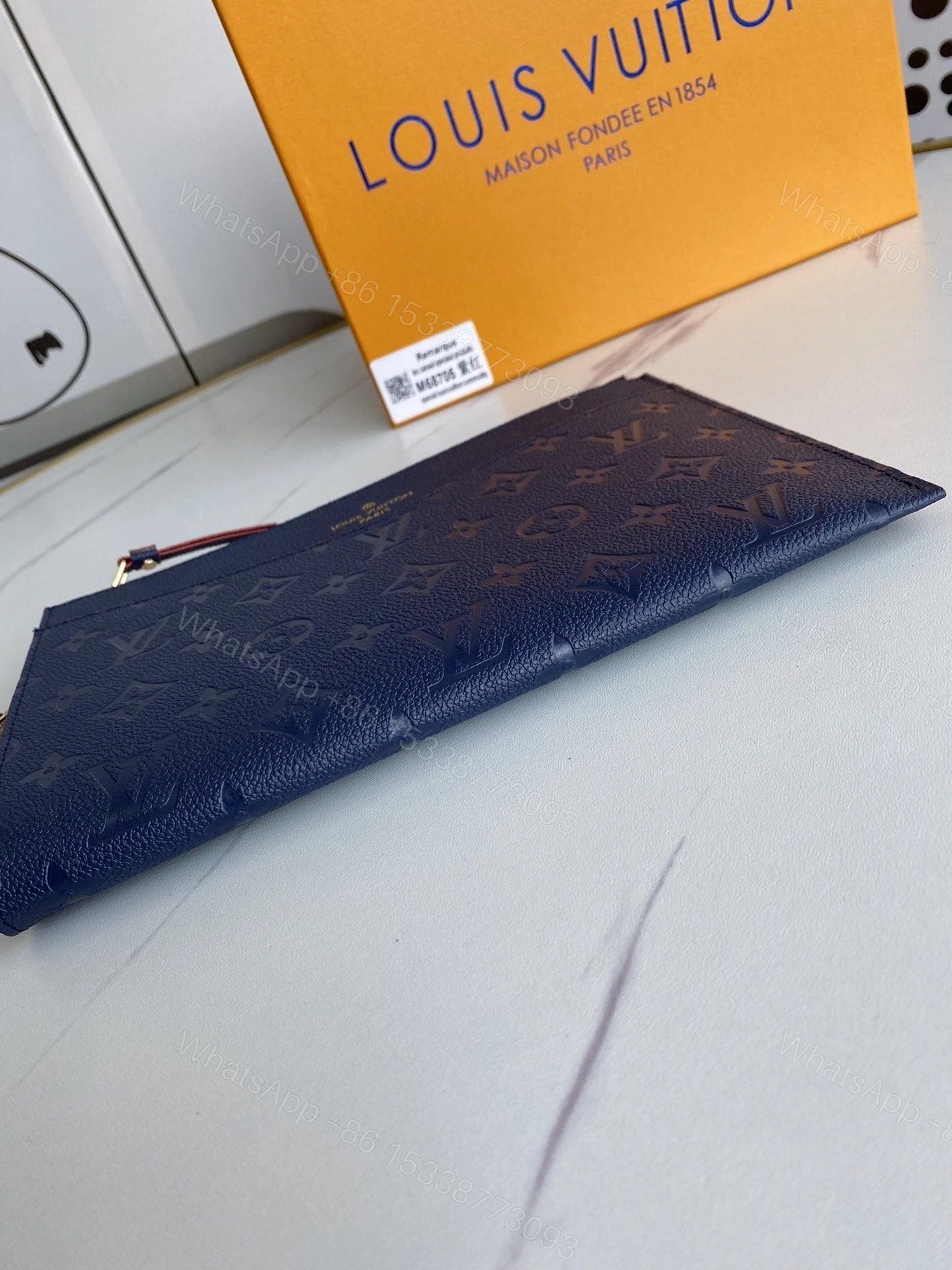 View 2 of Louis Vuitton Marine Rogue Monogram Empreinte Daily Pouch