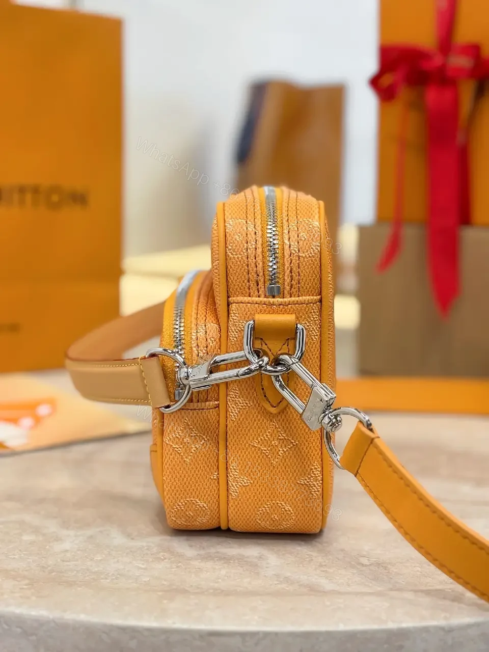 View 9 of Caramel Canvas Crossbody: Textured Monogram, Compact Chic