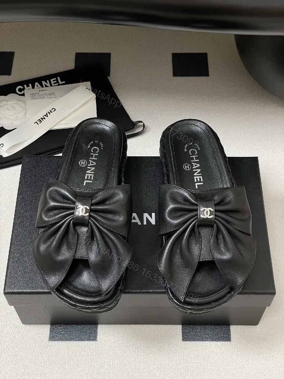View 2 of Chic Black Quilted Slides with Bow Detail - Luxury Casual Platform