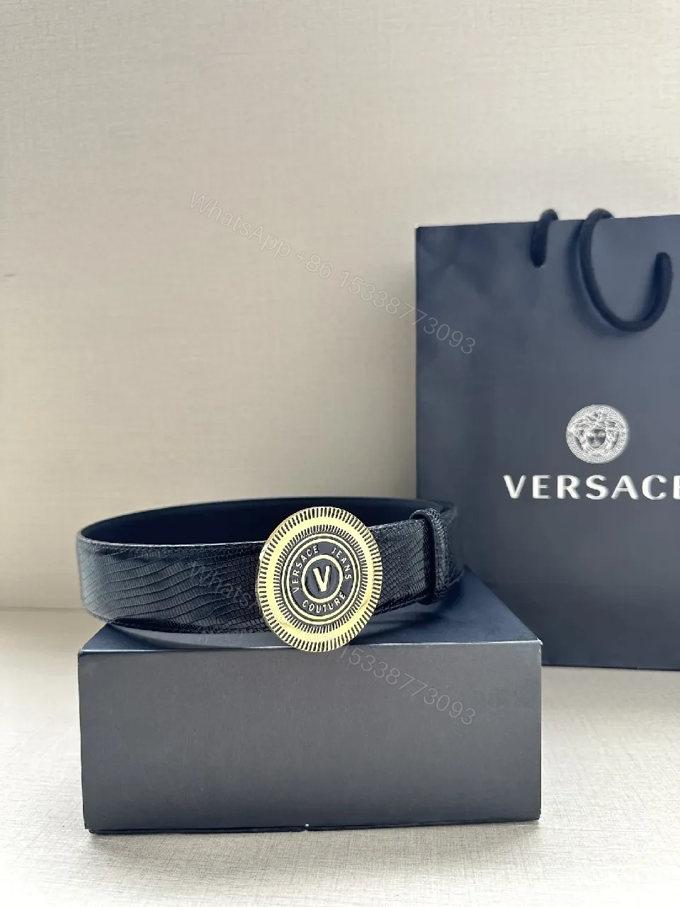 View 4 of Textured Leather Belt with Round Emblem Buckle – Luxe Minimalist Style