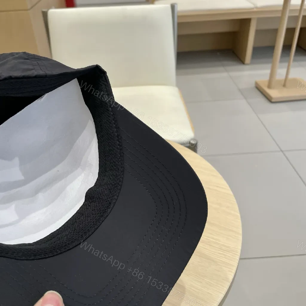 View 3 of Compact Black Cap with Subtle LV Patch, Six-Panel, Adjustable Strap