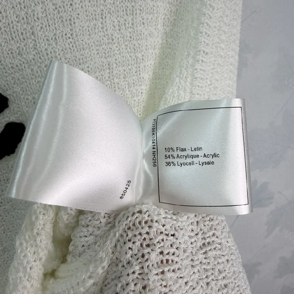 View 5 of White boucle knit relaxed-fit sweater with Chanel logo