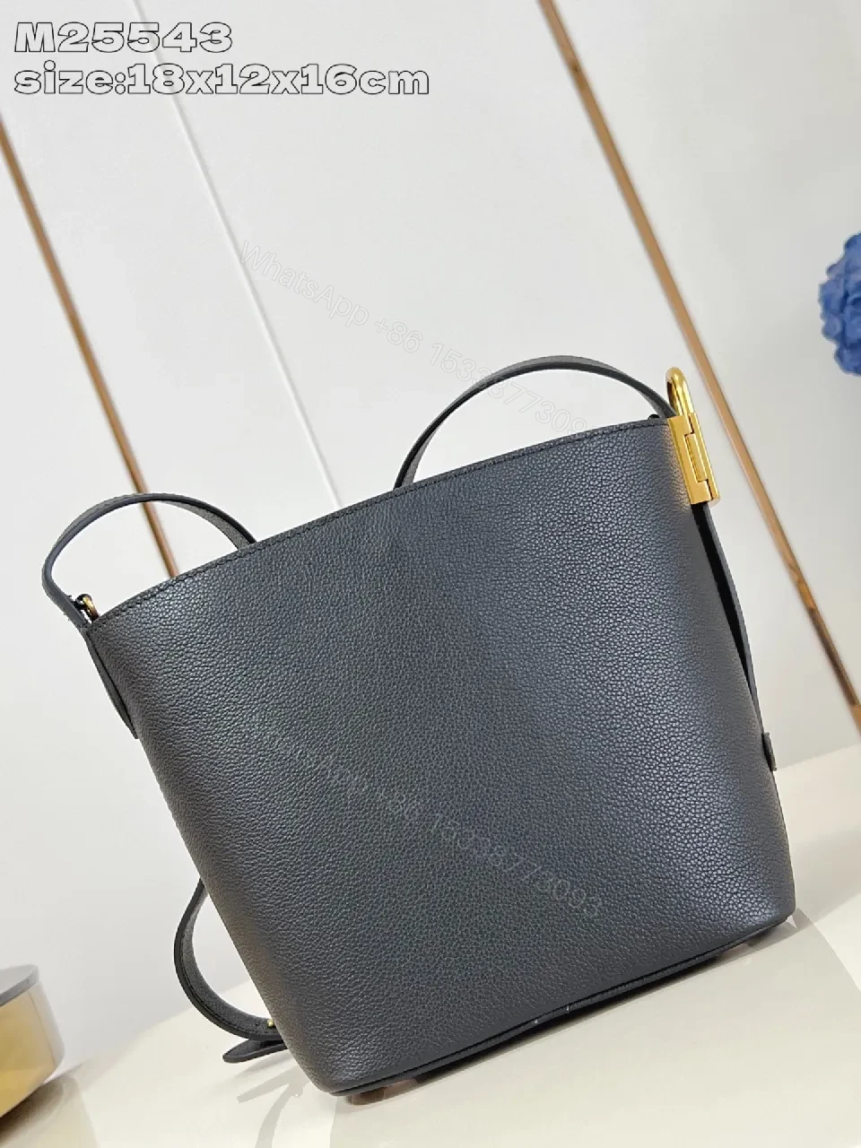 View 3 of Polished Grain Leather Bucket Bag with Gold Hardware, Minimalist Style, Everyday Carry