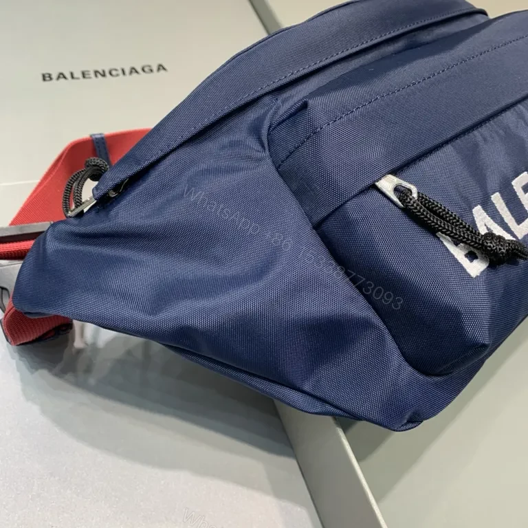 View 2 of Bold Navy Balenciaga Belt Bag with Red Strap - Hands-Free Luxury