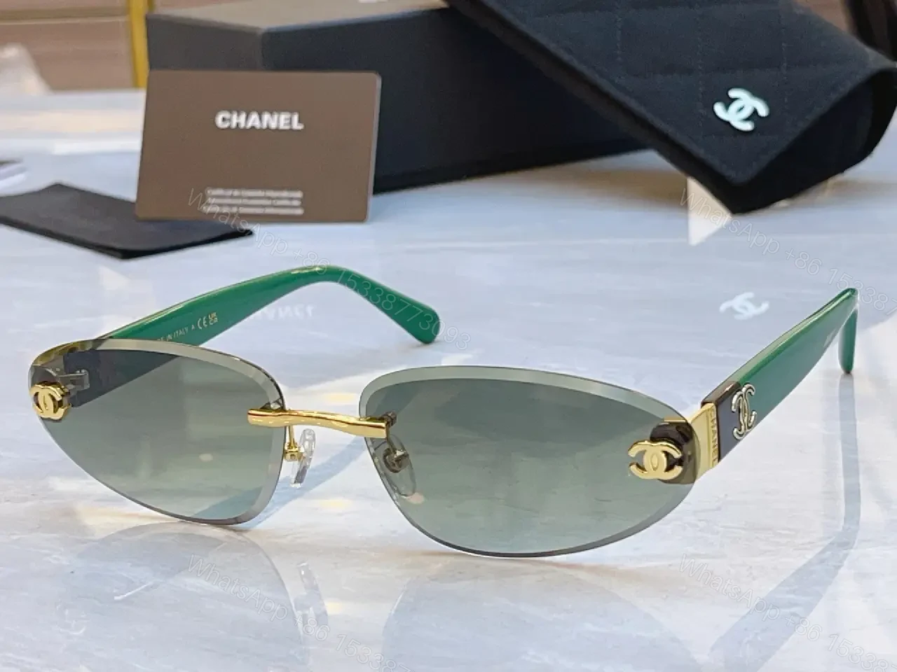 View 4 of Luxurious Silver-Gray Sunglasses: Gold Accents, Semi-Rimless Oval, Chanel Hardware