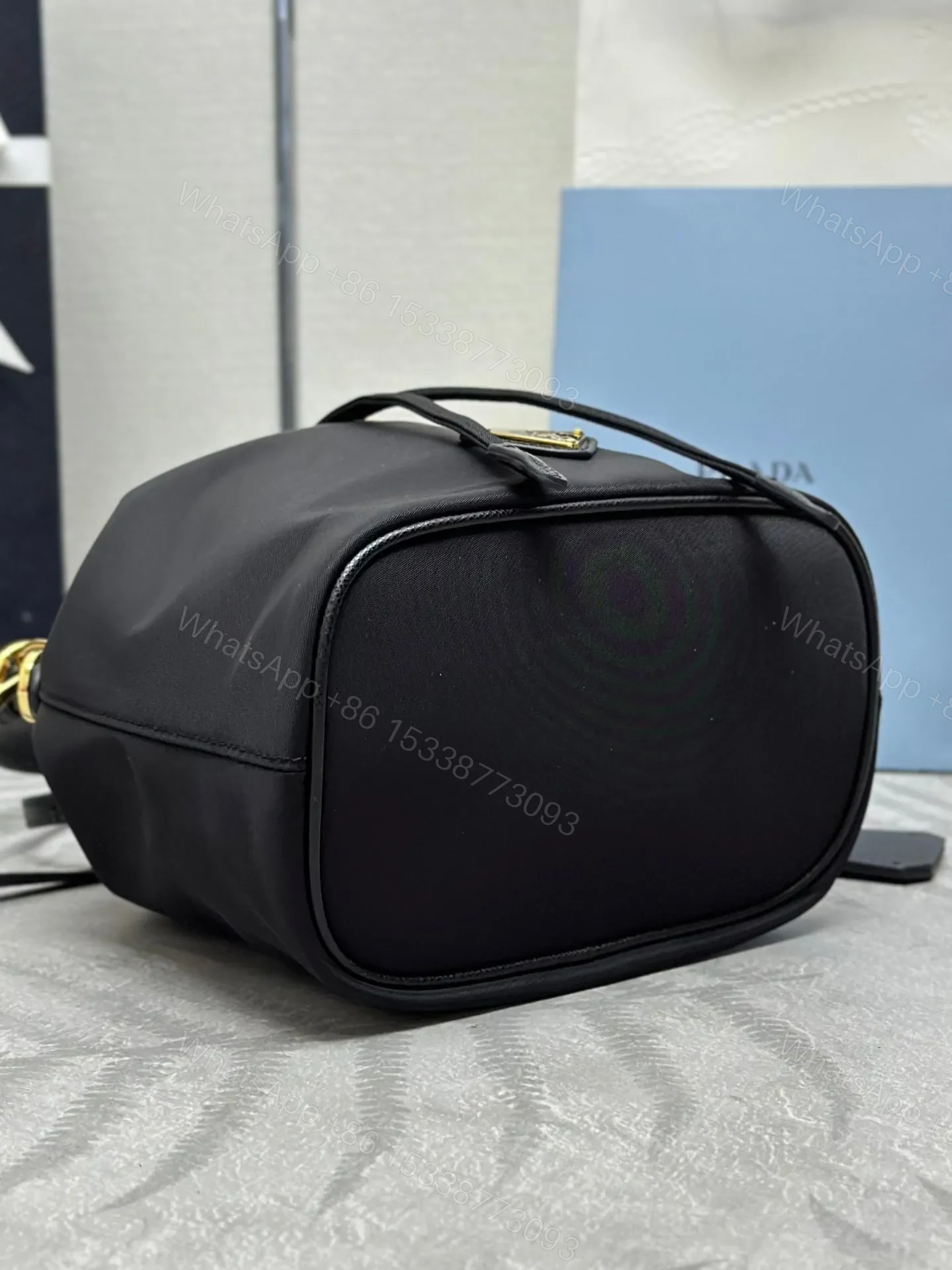 View 8 of BUCKET BAG 19 IN BLACK RE-NYLON AND CALFSKIN HANDLE