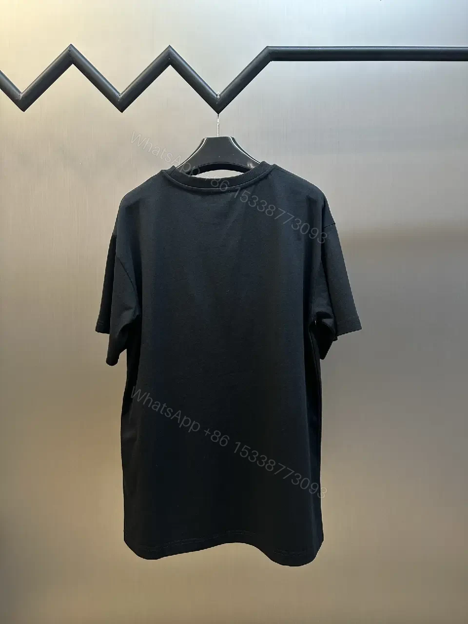 View 4 of Minimalist Black Tee with Red Pocket Detailing - Premium Unisex Tee