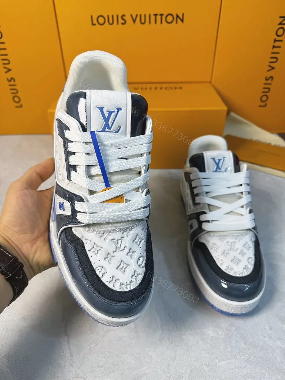 View 8 of Bold Navy Leather Textured Sneakers with LV Accent