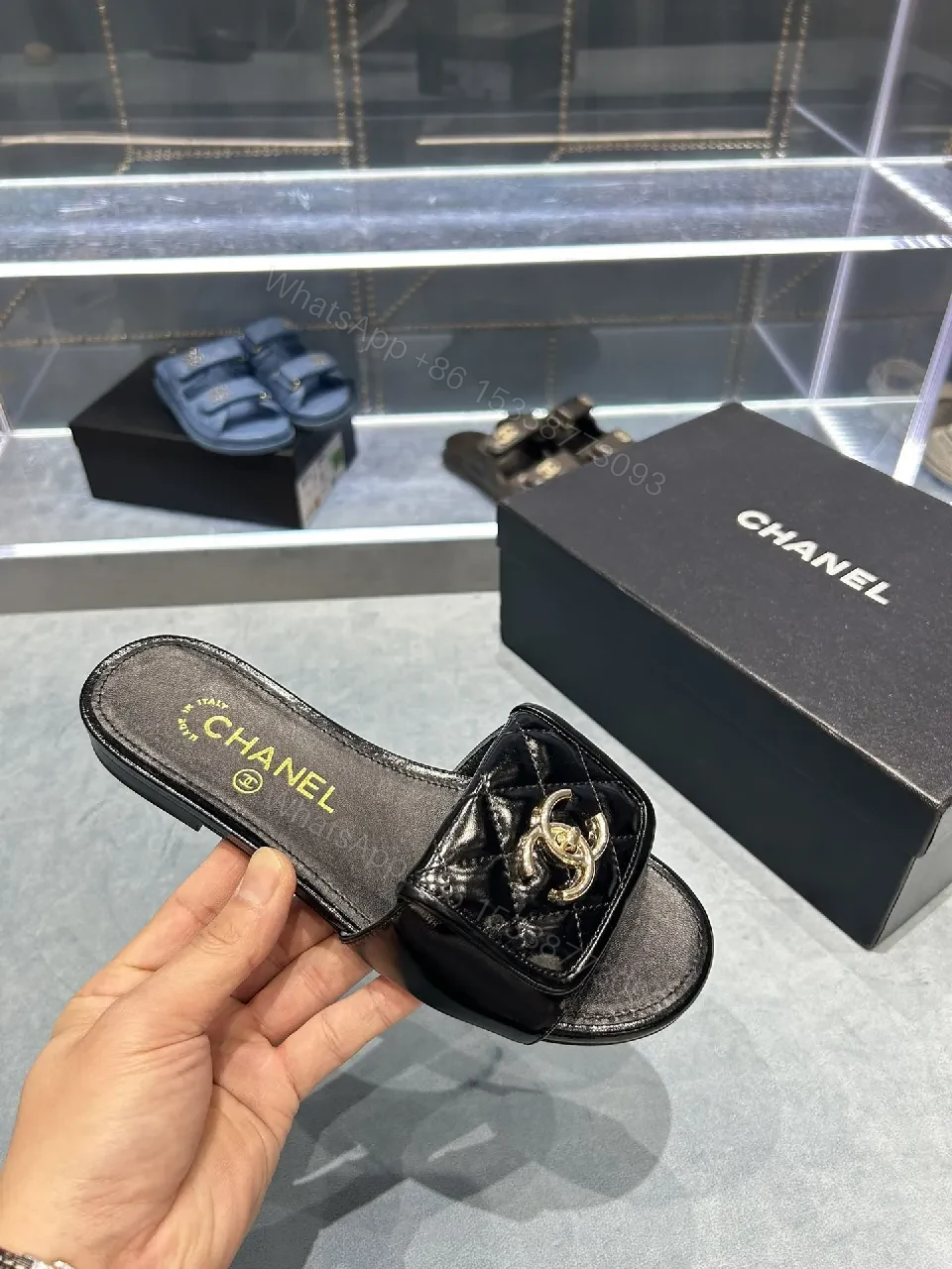 View 3 of Black Quilted Leather Slide with Gold Logo Escort