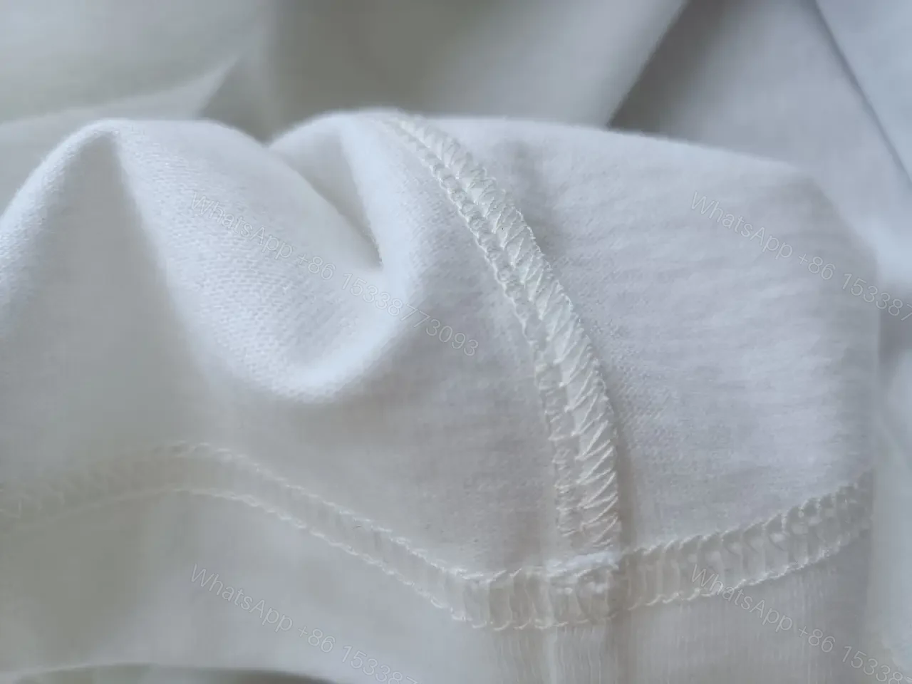 View 3 of Minimalist White Cotton Tee - Relaxed Luxe Comfort