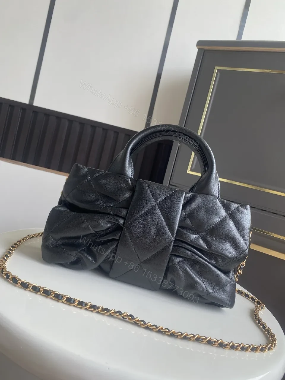 View 6 of Quilted Mini Bag: Black, Satin-like, Chic, Gold Hardware, Clutch