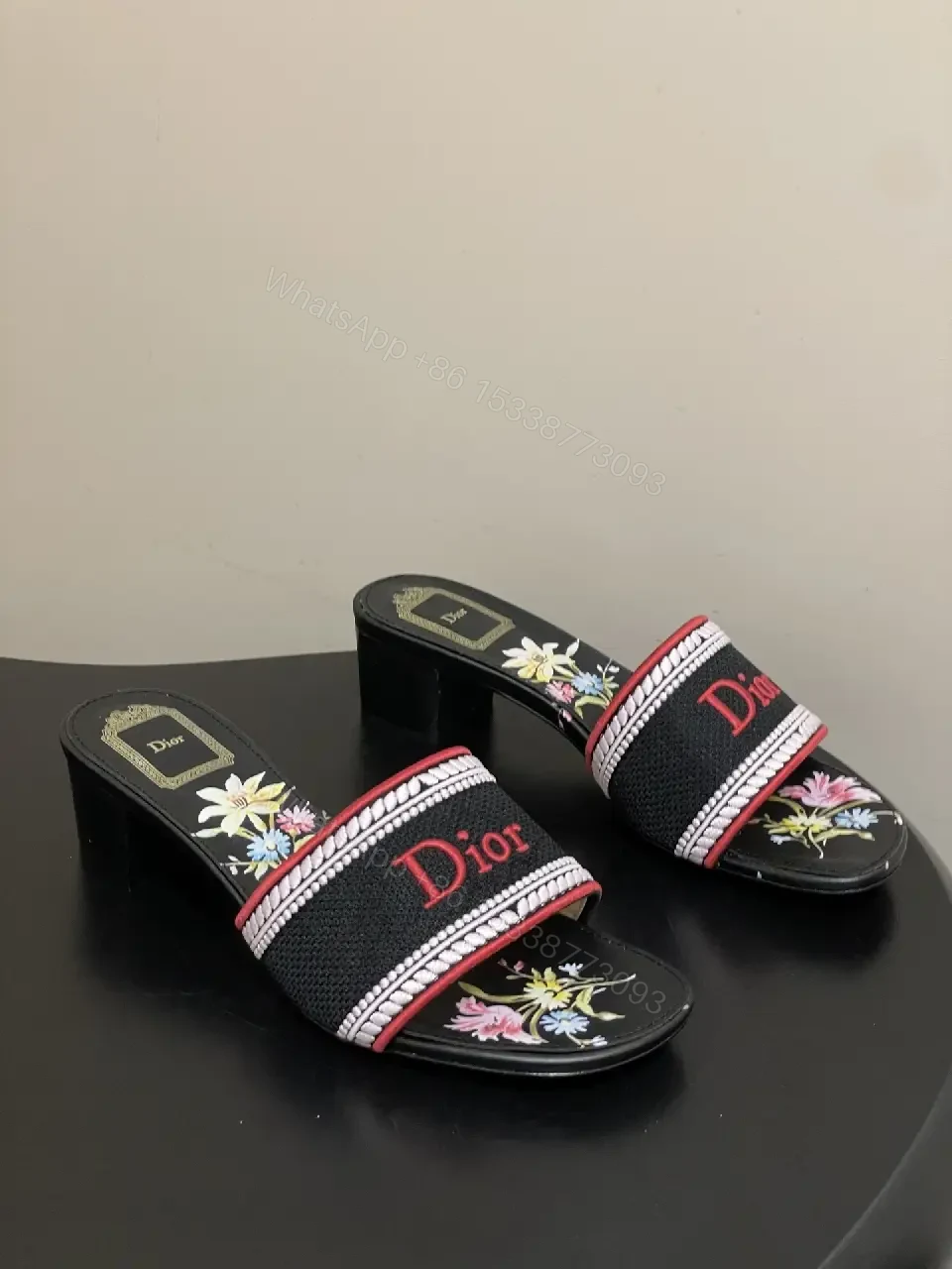 View 2 of Embroidered Slip-Ons with Bold Branding Sandals