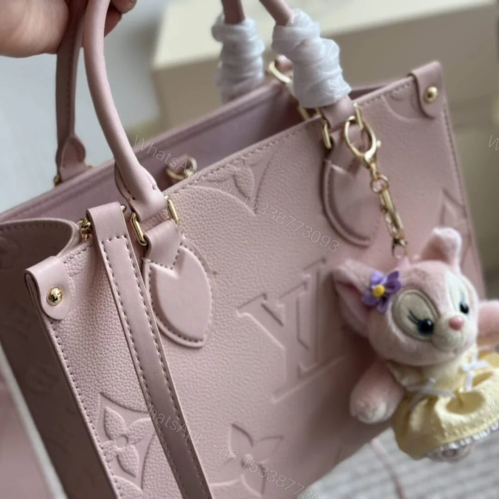 View 4 of Louis Vuitton Onthego PM Monogram Empreinte Pink Opale 25Cm M47135