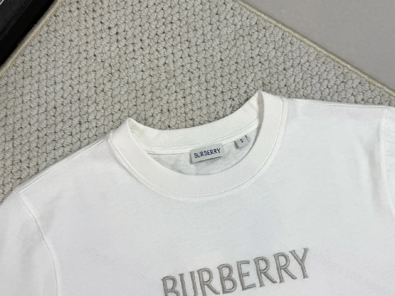 View 4 of White Cotton Tee with Metallic Crest Detailing, Premium Casual Style