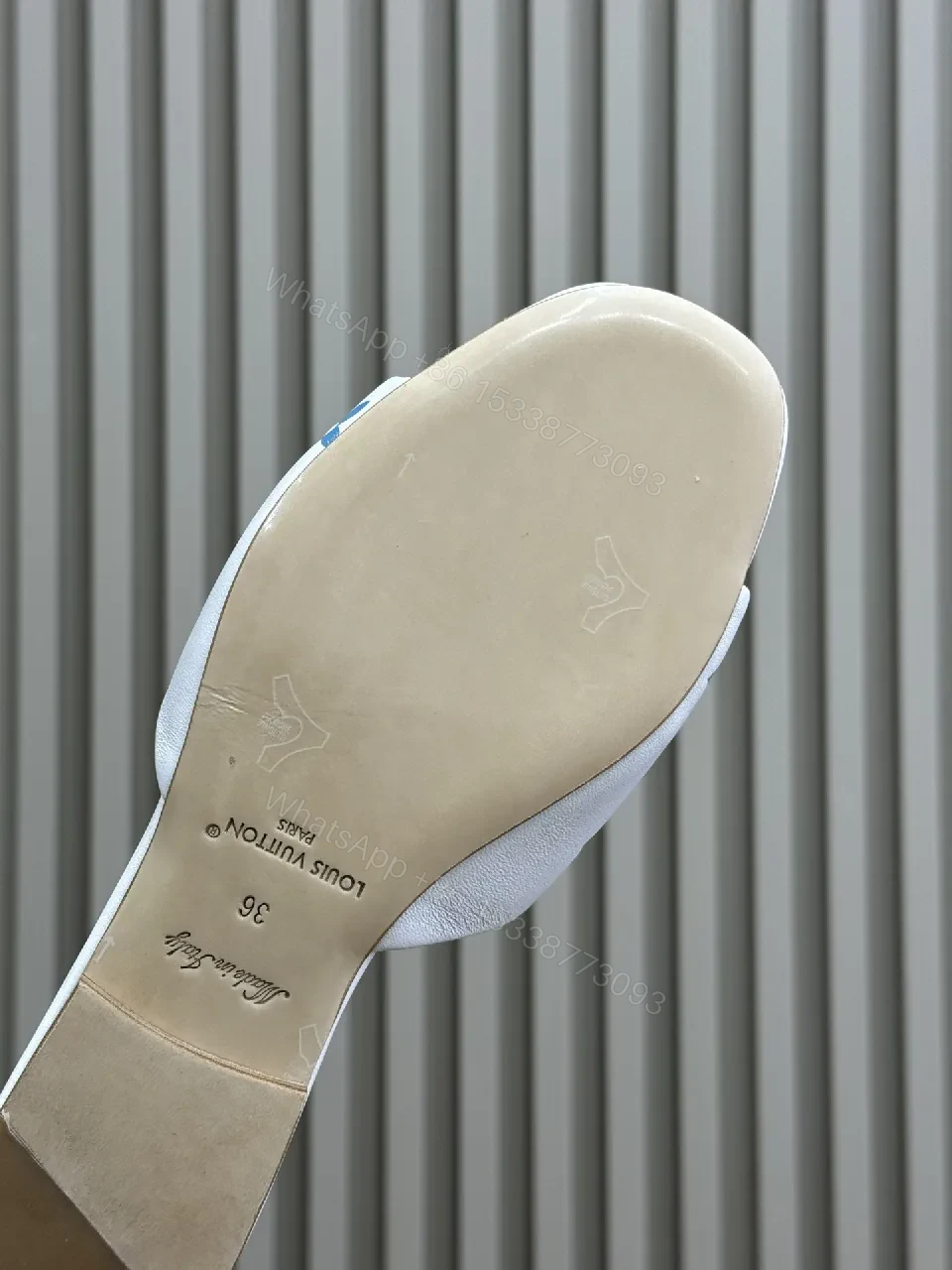 View 4 of White Leather Slides with Multicolor Monogram Detailing - Modern Luxury Comfort