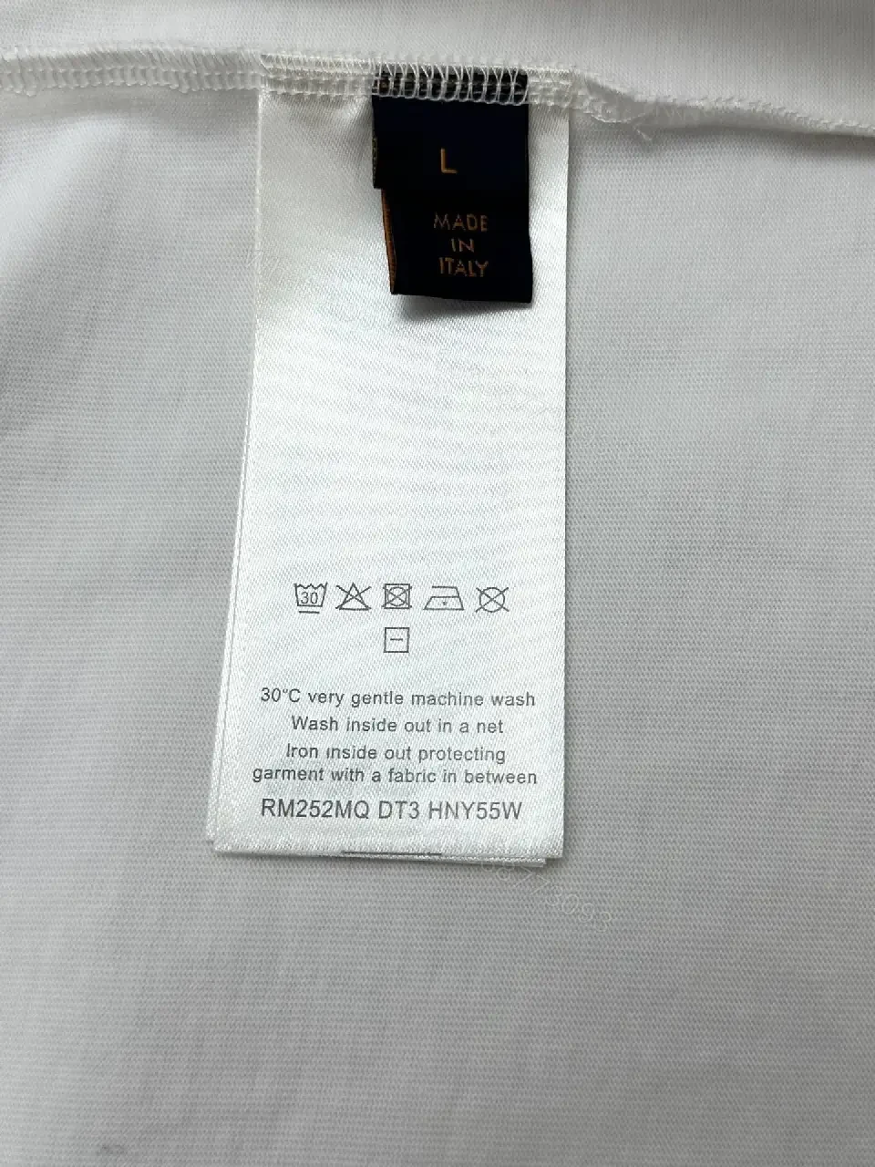 View 5 of Minimalist White Cotton Tee with Embossed Accent, Everyday Luxury