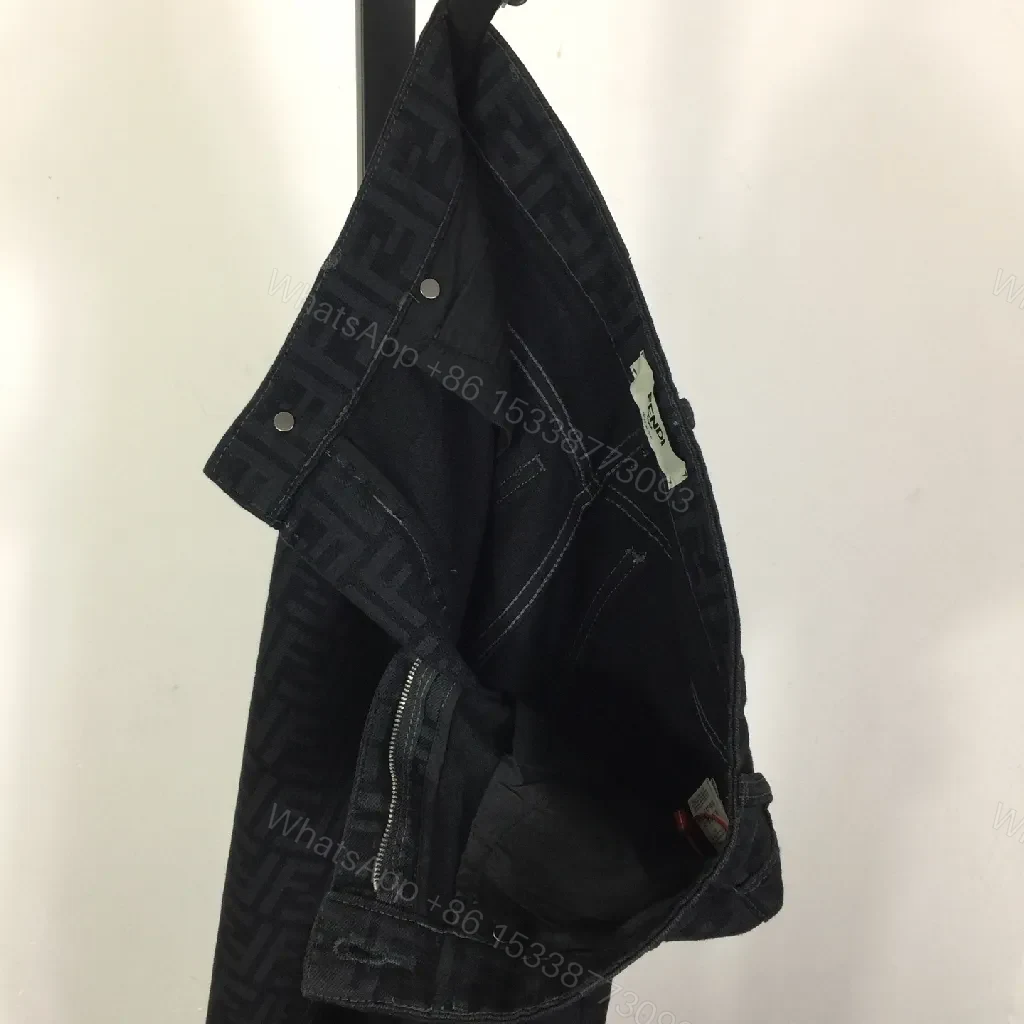 View 2 of Monogram Denim Trousers - Structured Texture, Modern Versatility