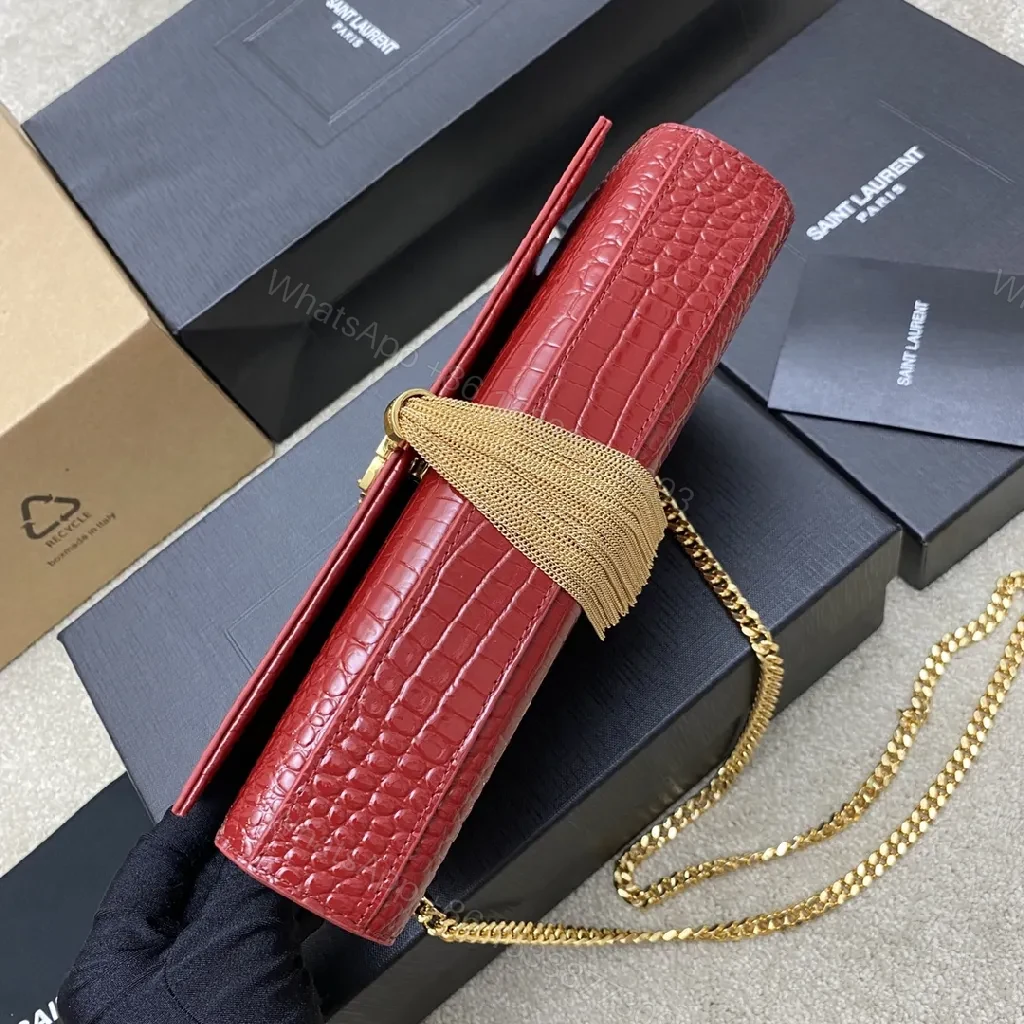 View 2 of Structured Red Leather Clutch with Gold Hardware and Tassel