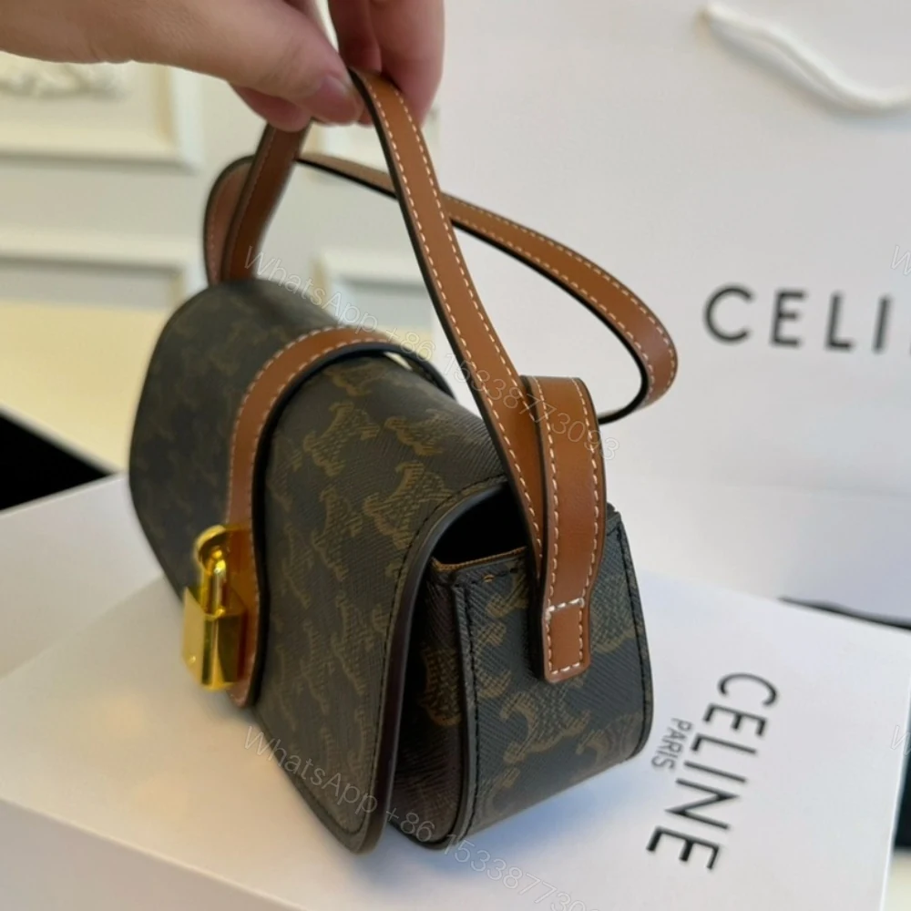 View 4 of CELINE CLUTCH ON STRAP TABOU IN TRIOMPHE CANVAS AND CALFSKIN TAN 20CM 10I592DQ2 04LU