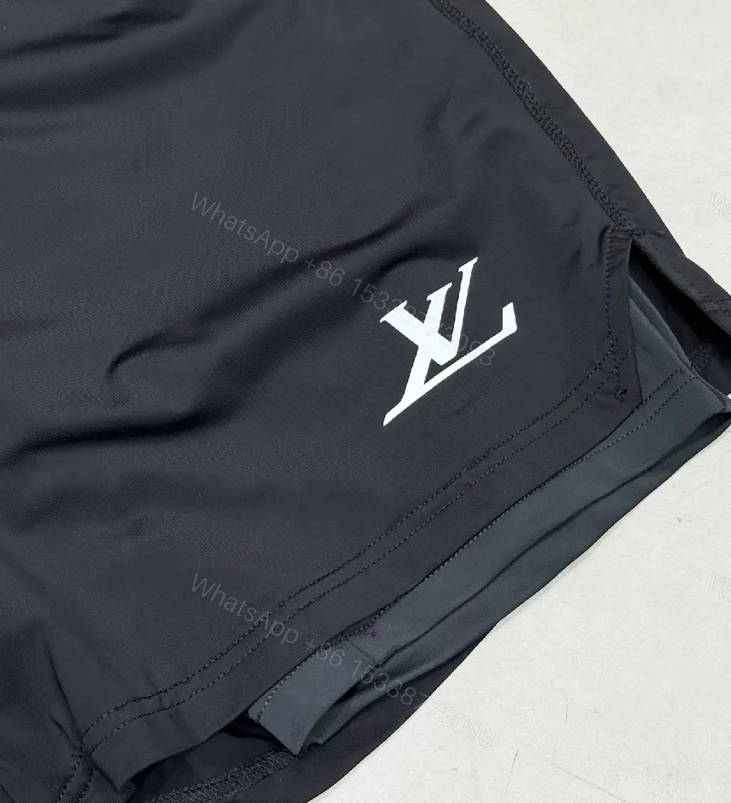 View 3 of Matte Black Quick-Dry Shorts with Subtle LV Detailing