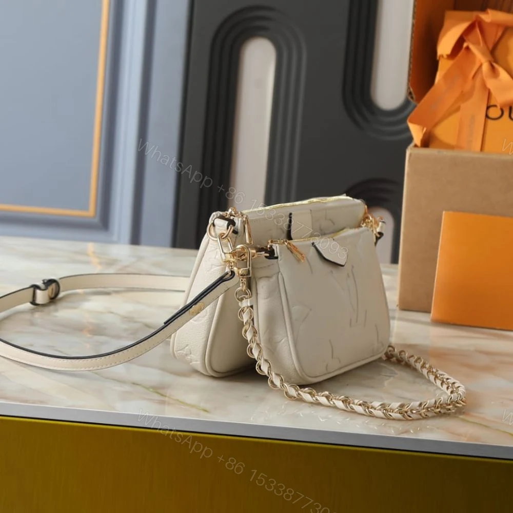 View 3 of Louis Vuitton Multi Pochette Accessoires Monogram Empreinte Cream 25Cm