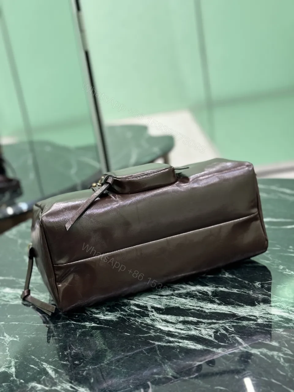 View 7 of Chic Black Leather Handbag with Gold Hardware & Structure