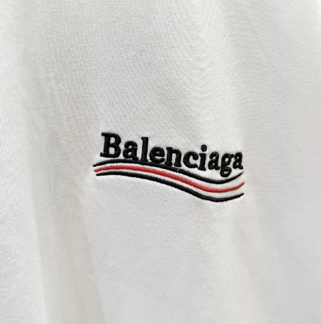 View 6 of Minimalist White Tee: Subtle Logo, Premium Cotton Short Sleeve Tee