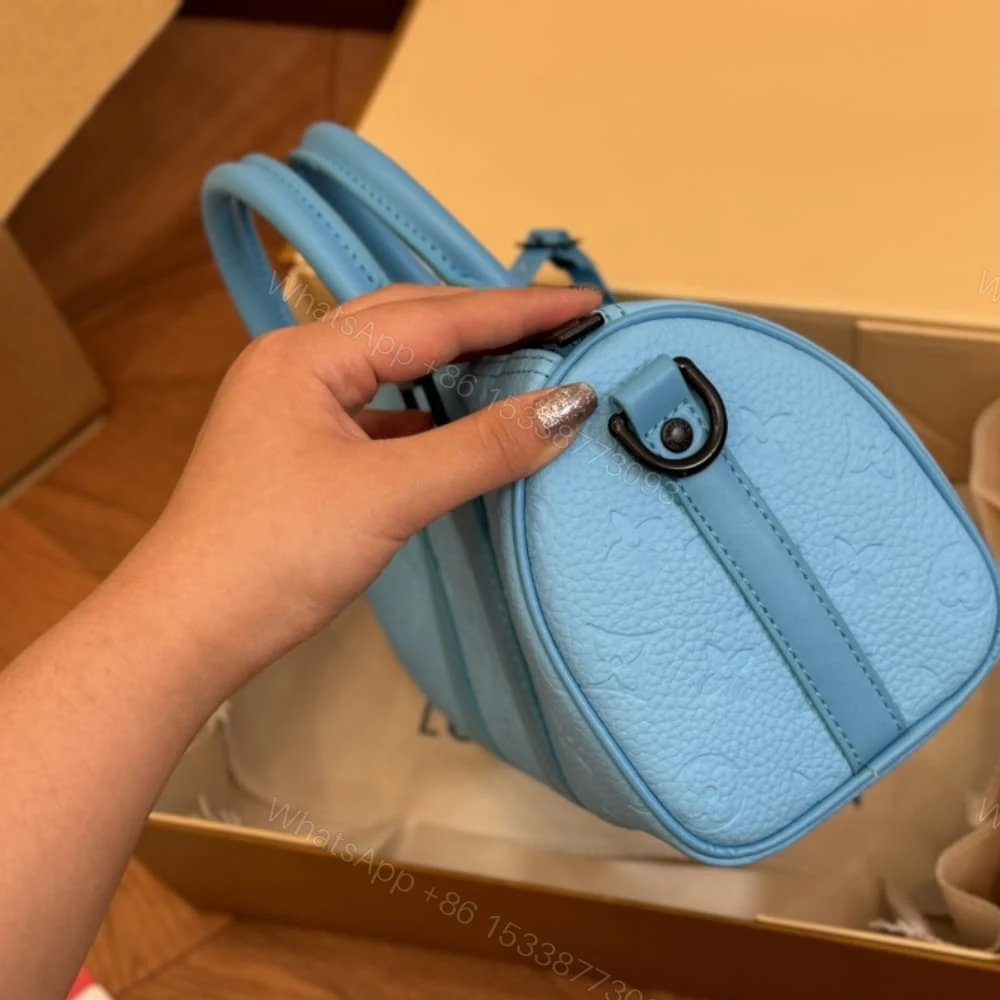 View 5 of Louis Vuitton Keepall Bandoulière 25 Turquoise 25Cm M11996
