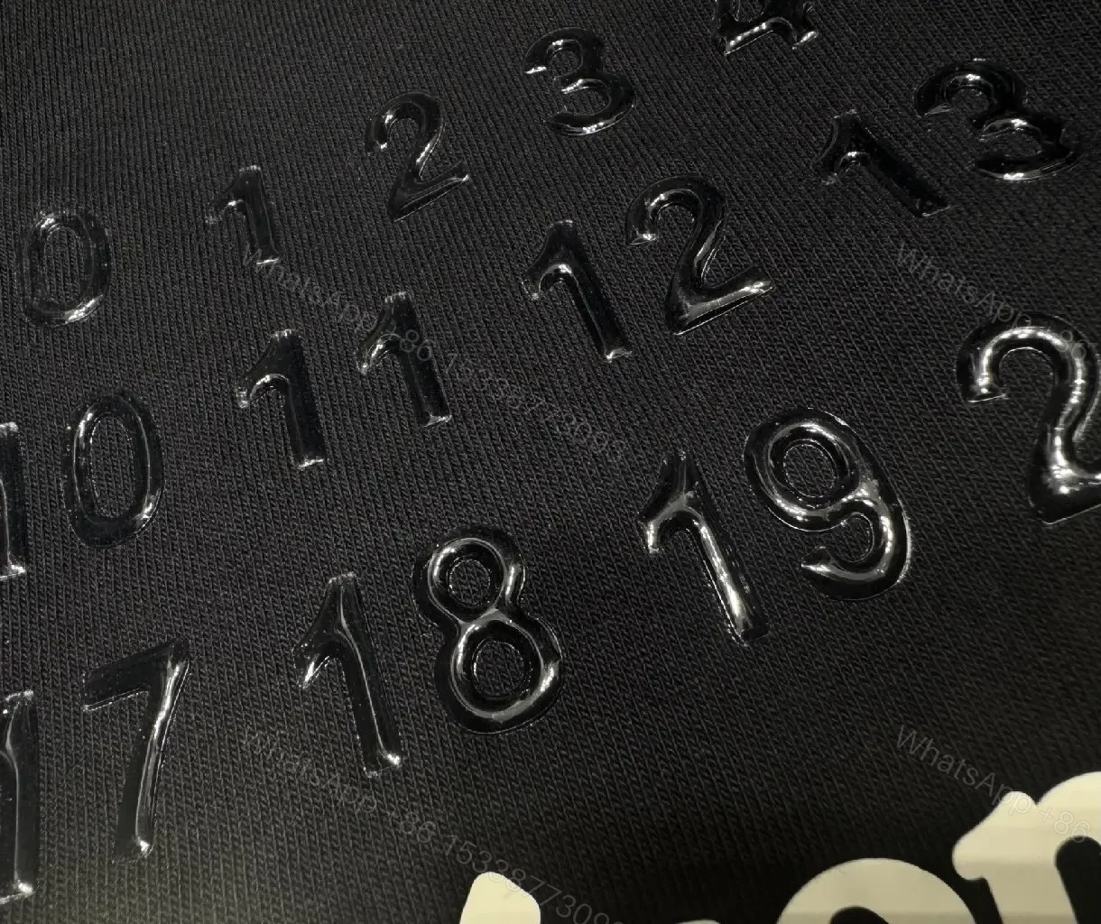 View 7 of Oversized Black Tee with Embossed Numeric Grid - Modern Graphic Comfort