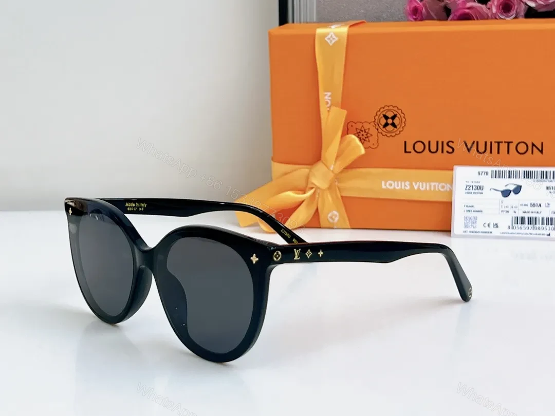 Sleek Black Round-Frame Sunglasses with LV Accents — view 1